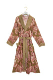 Floral patterned robe on a hanger against a white background