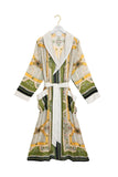 Patterned robe on a hanger against a white background