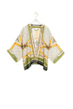 Patterned jacket on a hanger against a white background