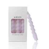 Purple spiral candles with packaging displaying 'Maegen' brand on a white background