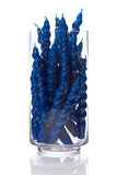Blue spiral candles in a clear glass vase on a white background