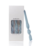 Blue twisted candle in a Maegen box on a white background