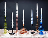 Set of colorful candlesticks on a dark background
